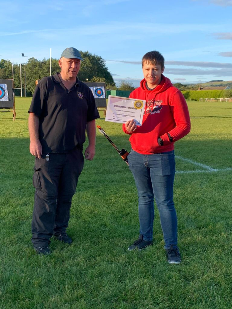 a beginner being presented with a certificate