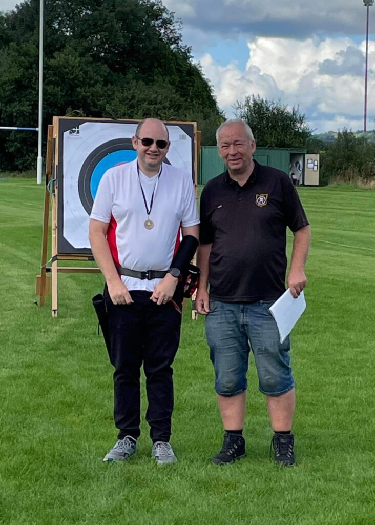 a Neath Archers' member recieving a medal 